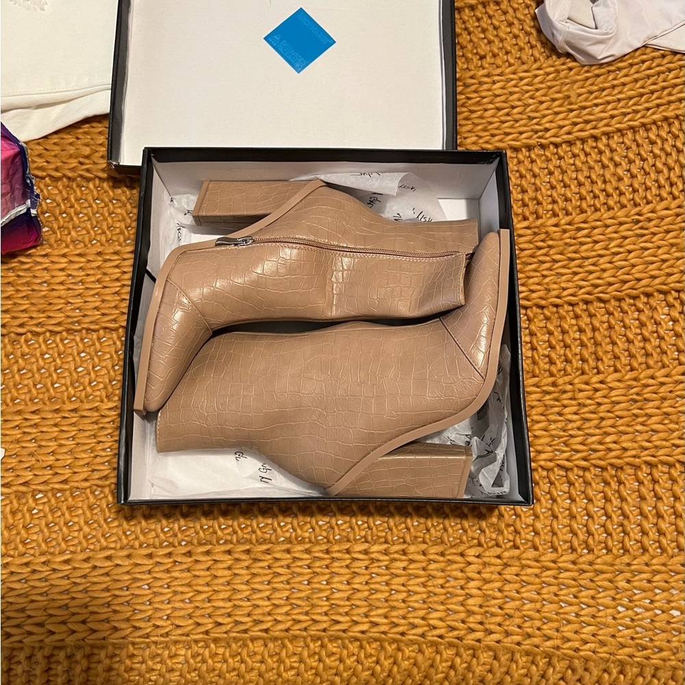 Snake print booties. Size 6. NWT